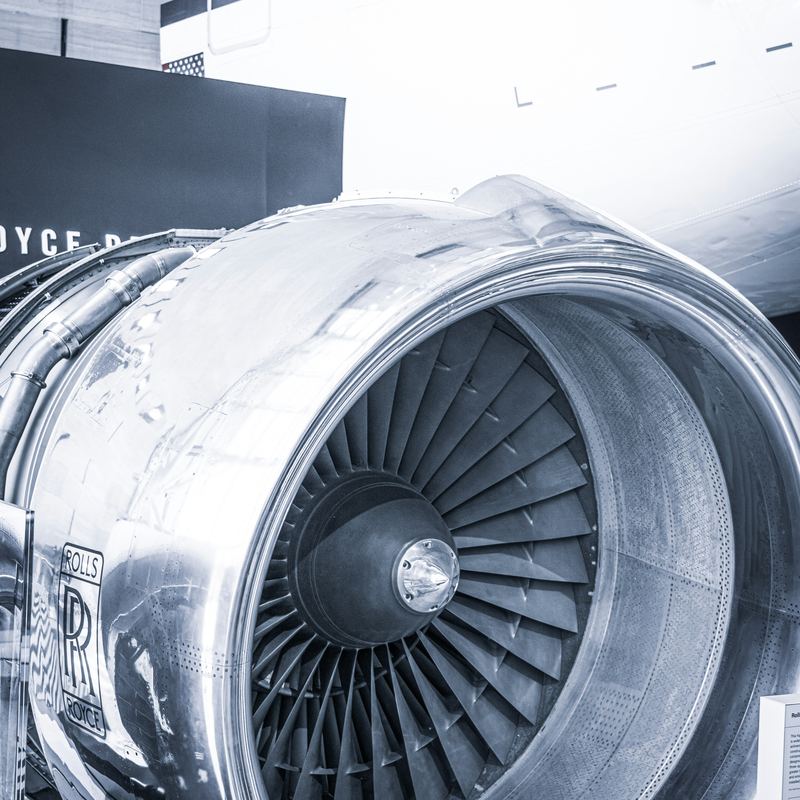 Rolls-Royce turbofan engine beside an airliner