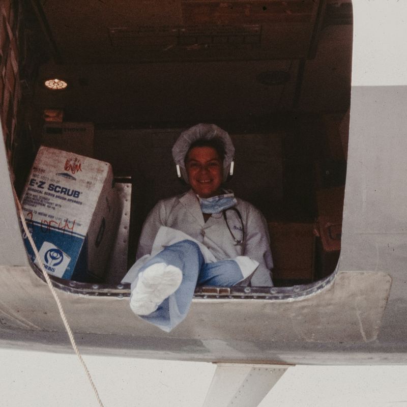 Medical team in the cargo door of an aircraft